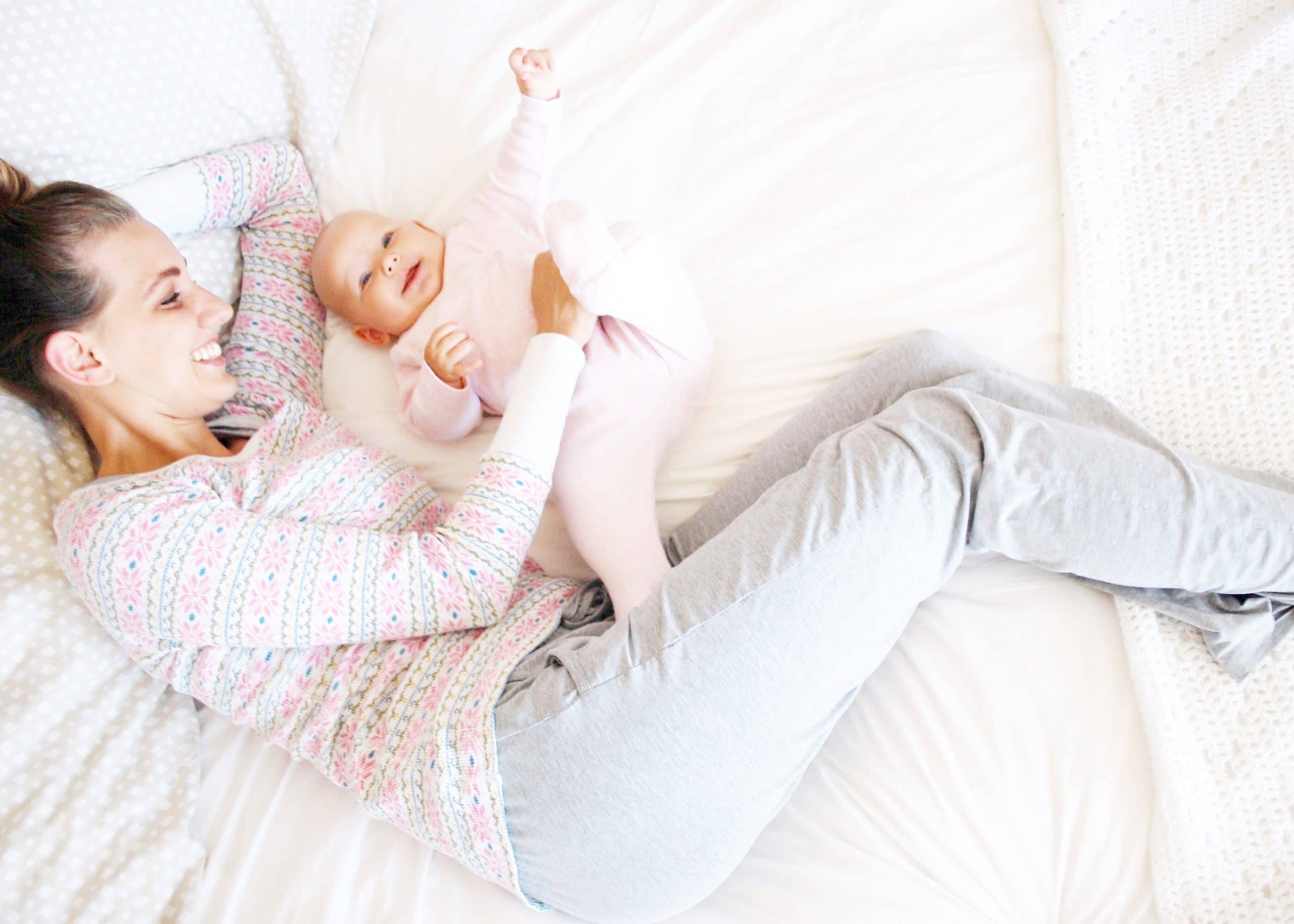 Co-sleeping with Lily smiling and foot up